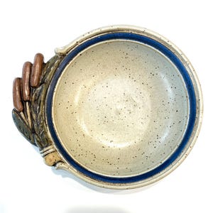 May include: A handmade wooden sign with the text "Welcome" in a cursive font. The sign is painted white with a distressed finish and features a small, decorative floral element. It is designed for indoor or outdoor use.