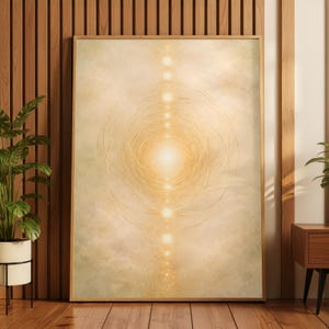May include: A framed abstract art print featuring a central glowing light source surrounded by concentric circles and a vertical line of illuminated orbs. The artwork has a warm, golden color palette with a soft, ethereal quality, suitable for home decor.