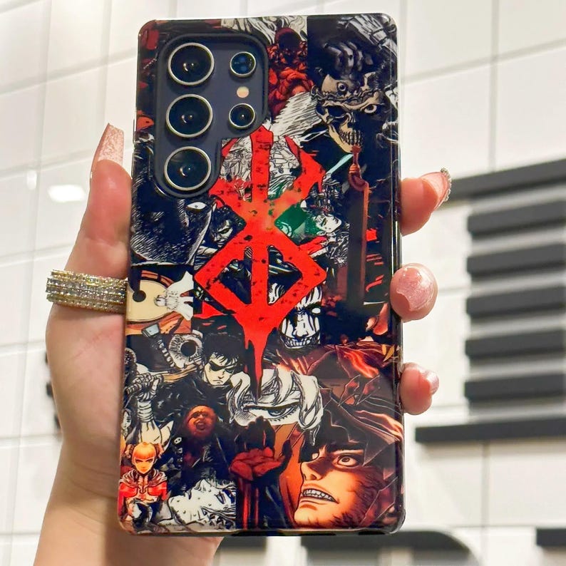 May include: A black phone case with a colorful collage of anime characters and a large red symbol. The symbol is a stylized 'B' with a jagged edge.