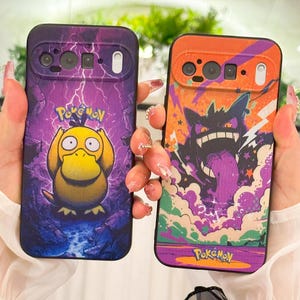 May include: Two phone cases featuring Pokemon characters. One case is purple with a Psyduck graphic, lightning bolts, and the Pokemon logo. The other case is orange with a Gengar graphic, stars, and the Pokemon logo.