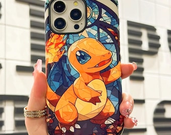May include: A phone case with a stained glass design featuring a cartoon orange and yellow Pokemon character with flames. The background is a dark blue with a stained glass pattern.