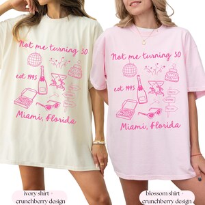 May include: Two oversized t-shirts with a pink graphic design that says "Not me turning 30 est 1995 Miami, Florida". The shirt on the left is ivory and the shirt on the right is pink.