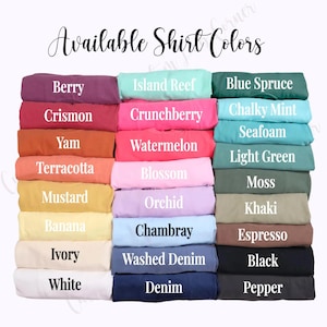 May include: A chart of available shirt colors, with each color displayed in a folded fabric swatch. The colors include Berry, Crismon, Yam, Terracotta, Mustard, Banana, Ivory, White, Island Reef, Crunchberry, Watermelon, Blossom, Orchid, Chambray, Washed Denim, Denim, Blue Spruce, Chalky Mint, Seafoam, Light Green, Moss, Khaki, Espresso, Black, and Pepper.