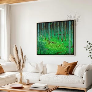 May include: A framed forest landscape painting with a vibrant green meadow and tall trees. The artwork features a black frame and is displayed in a modern living room with a white sofa and wooden coffee table. The text "Studio Michi" is in the upper right corner.