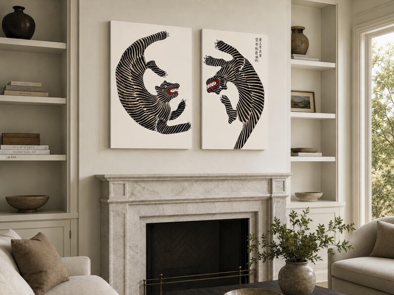 May include: Two rectangular wall art prints featuring stylized black and white tigers with red mouths. The tigers are depicted in dynamic, leaping poses with striped patterns. The right print includes vertical Japanese text in the upper corner.