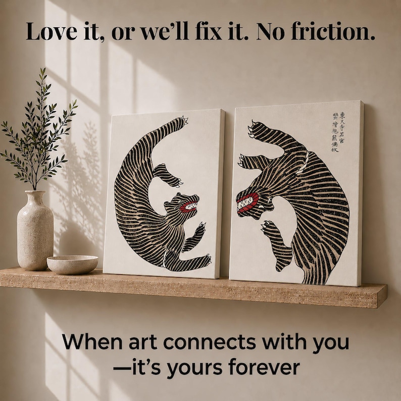 May include: Two rectangular canvas prints featuring black and white striped tiger illustrations with red mouths and sharp teeth. The right print includes vertical Japanese text. The text "Love it, or we'll fix it. No friction." and "When art connects with you&mdash;it's yours forever" is visible.