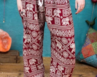 May include: Red trousers with a white elephant and geometric pattern.