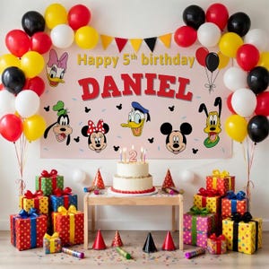 May include: A festive birthday scene with a banner reading "Happy 5th birthday DANIEL" featuring Disney characters. Colorful balloons in red, yellow, black, and white surround the banner. A two-tiered cake with candles sits on a table, surrounded by wrapped gifts.