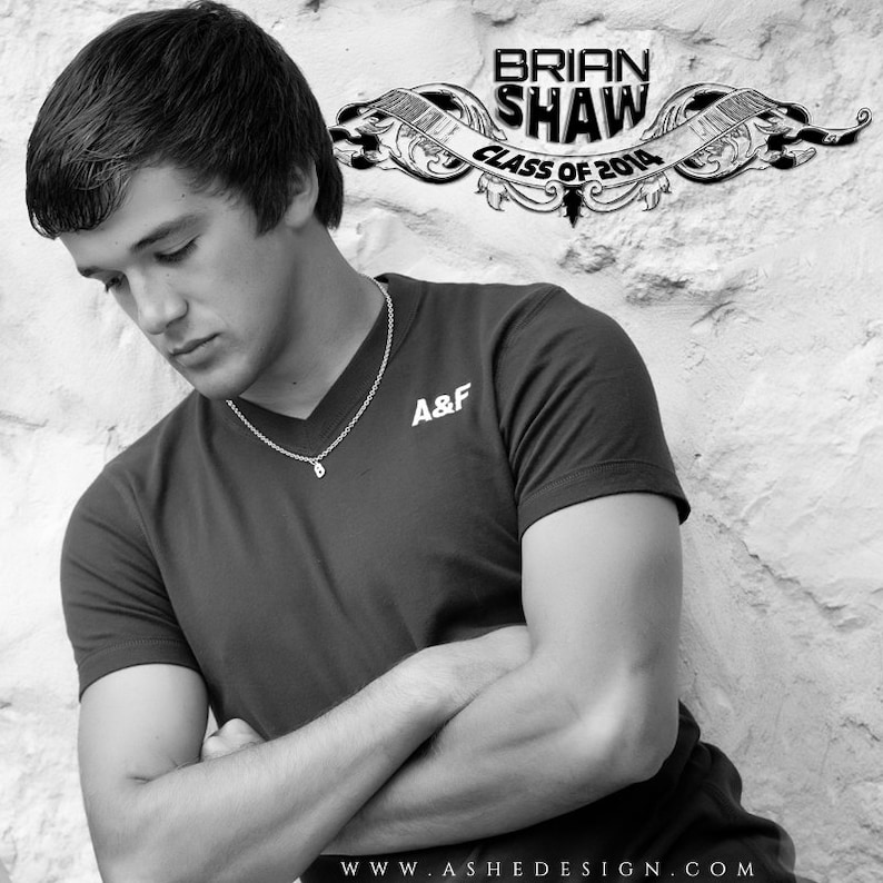 May include: Black and white portrait of a young man wearing a black v-neck shirt with the words "A&F" on the front. He is wearing a silver chain necklace. The background is a white brick wall with a black and white banner that reads "Brian Shaw Class of 2014".