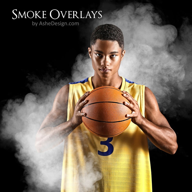 May include: A basketball player wearing a yellow jersey with a blue number 3, holds a basketball in front of a white smoke background.