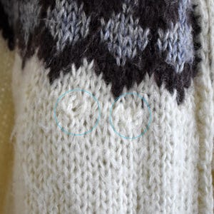 Close-up of a few small pulls in the knit