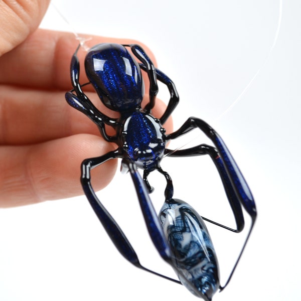 Lunching Blue Aventurine Orb Weaver Spider - lampworked glass spider and captured spun prey figurine made by Glass Artist Wesley Fleming
