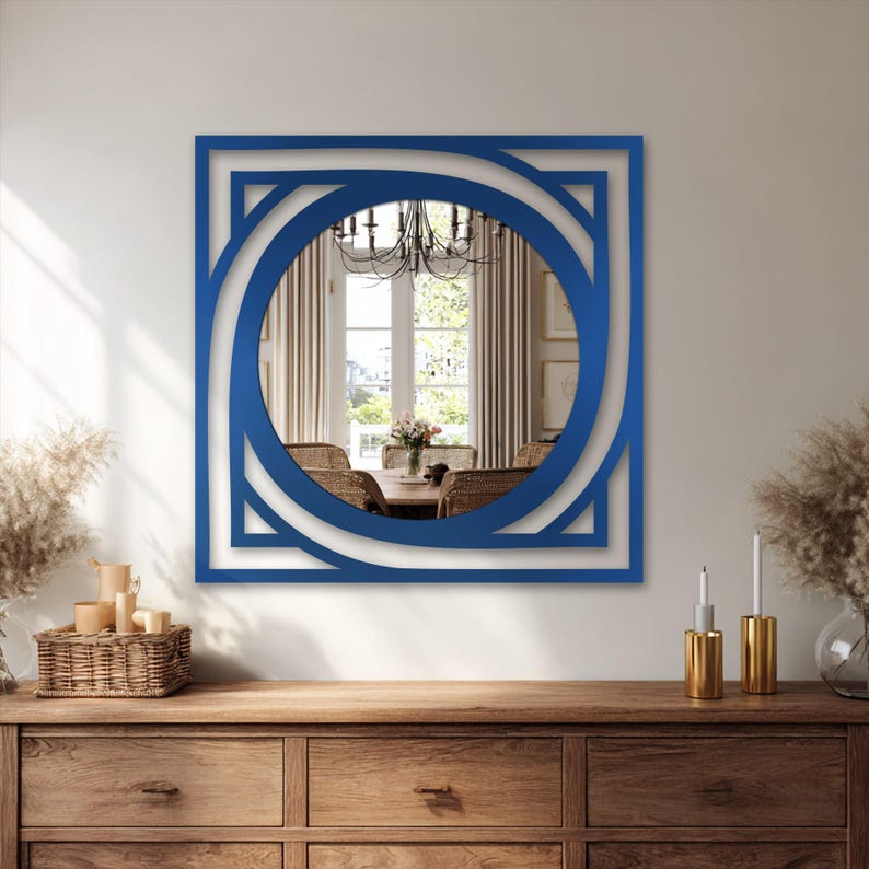round wall mirror with modern square metal frame, minimalist black decor for living room