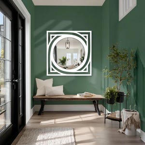 contemporary round wall mirror with black metal square frame, minimalist modern interior accent