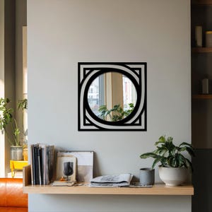 round mirror with square black metal border, contemporary wall decor for apartment