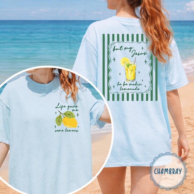 May include: Light blue t-shirt with the text "Life gave me some lemons" and a lemon graphic on the front. The back features the text "but my Jesus he be makin' lemonade" with a lemonade graphic.