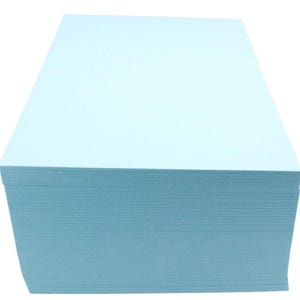May include: A stack of light blue cardstock paper.