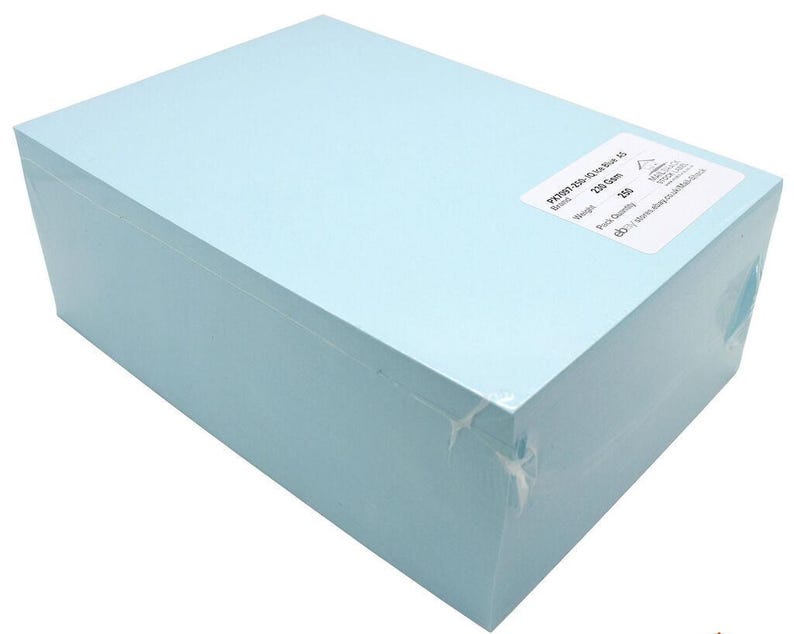 May include: A light blue box of 250 sheets of 70gsm paper. The box is labeled "70gsm 250-Sheet Blue Box 45" and "250 Count".
