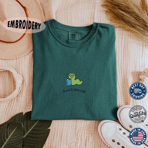 Bookworm Embroidered Tee – Bookish Outfit Comfort Colors® Tee, Gift For Book Lover, Book Nerd Tee, Book Club Gift, Teacher Crewneck T-Shirt