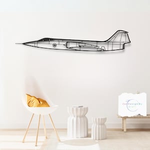 May include: Black metal silhouette of a jet airplane mounted on a white wall. The airplane is in flight position with the wings spread. There is a white chair with a yellow cushion and two white side tables in the foreground.