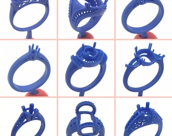 May include: Nine blue wax ring molds for jewelry making. The molds are on red stands and show different styles of rings.