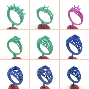 May include: Nine wax ring settings for jewelry making. The rings are in three colors: green, blue, and pink. The rings are on a white background.