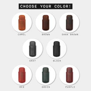 May include: Choose your color! A selection of ten leather cigar cases in various colors, including camel, brown, dark brown, gray, black, red, green, and purple.