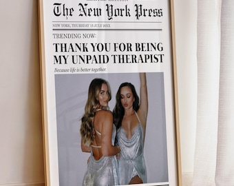May include: A newspaper-style print with the headline "The New York Press" and the text "Thank you for being my unpaid therapist. Because life is better together." Two women are pictured in the bottom half of the print, wearing silver dresses.