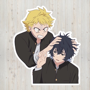 May include: A sticker depicting two anime-style characters. One character, with spiky blonde hair, is grabbing the other character's dark blue hair. Both characters wear black jackets over white shirts, set against a wooden background.