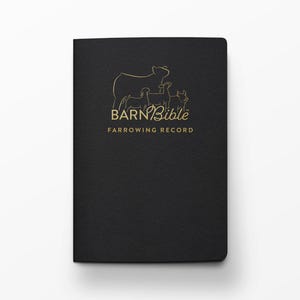 May include: Black hardcover book titled "Barn Bible Farrowing Record." The cover features a gold outline illustration of a pig and piglets above the title. The book is designed for recording farrowing information.