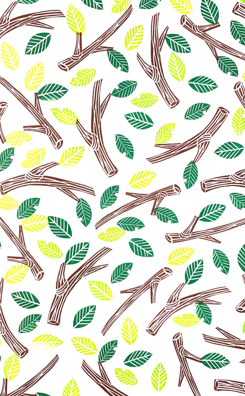 A sample image of nature-inspired pattern design using hand carved rubber stamps available in the shop. Twigs and leaves are stamped in random directions in brown, green and yellow green.