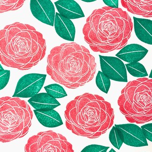 A sample image of pattern design using hand carved rubber stamps available in the shop. Camellia flowers are stamped in red and leaves are in green.