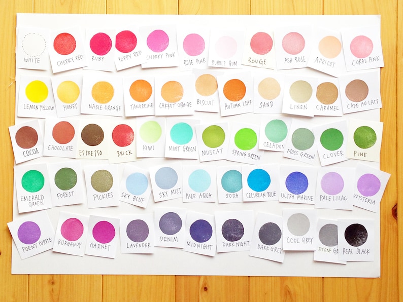 May include: A chart of 48 different colored paint swatches with the name of each color written below the swatch.