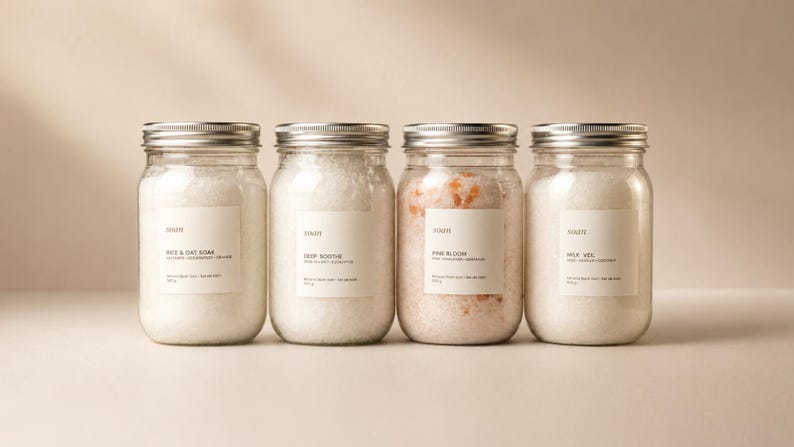 Four Soan mineral bath salt jars arranged together, showing the Forest Steam, Rice and Oat, Deep Soothe, Pink Bloom, and Milk Veil blend options