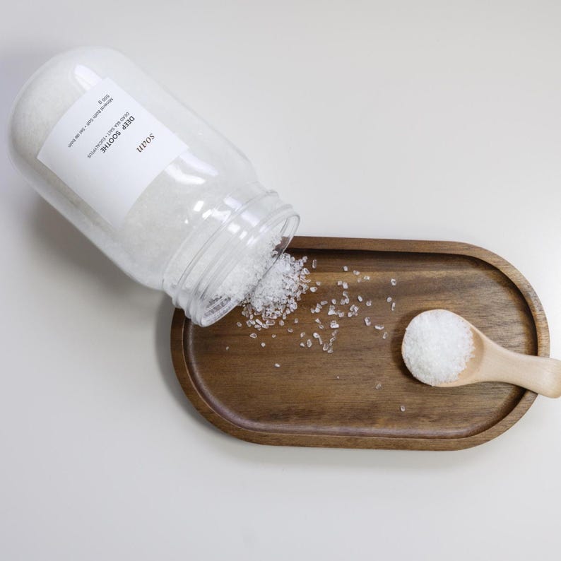 Luxury recovery bath salt in jar for soothing tired muscles and physical tension