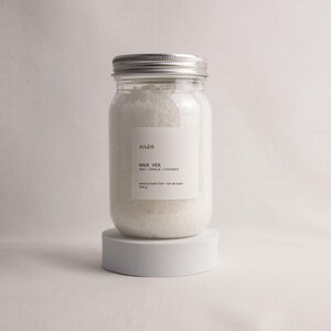 Bath salt collection set with floral, herbal, and skin-softening soaks arranged as a giftable spa ritual box.