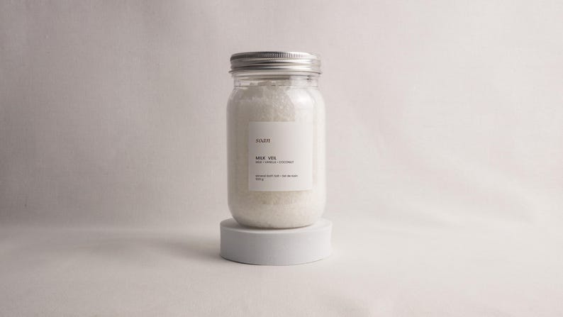 Bath salt collection set with floral, herbal, and skin-softening soaks arranged as a giftable spa ritual box.