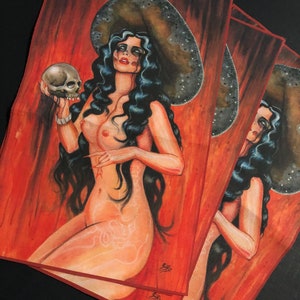May include: A painting of a woman with long black hair wearing a large, wide-brimmed hat. She is holding a skull in her left hand. The background is a red and orange gradient.