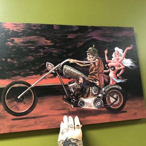 Motorcykeldemonen "Lyckans hjul", gicléecanvas - 40 x 60 cm, redo att hängas i man cave eller shed chopper biker
