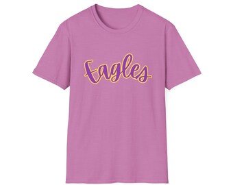 May include: A pink t-shirt with the word "Eagles" written in purple with a yellow outline.