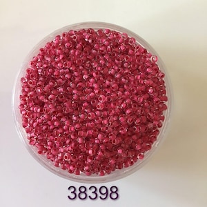 10/0 38398 Preciosa rocaille beads. Crystal, colored lining red. Czech glass beads.