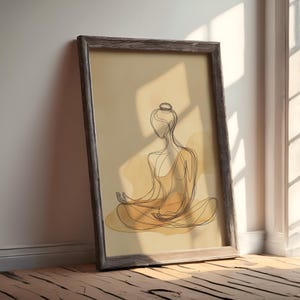 K&ouml;nnte beinhalten: Ein gerahmter Druck einer Linienzeichnung einer Person, die in meditativer Haltung sitzt. Die Zeichnung ist in Schwarz auf einem beigefarbenen Hintergrund mit Aquarell-Waschungen in Gelb- und Oranget&ouml;nen.