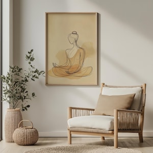 K&ouml;nnte beinhalten: Ein gerahmter Druck eines Strichzeichnung einer Person in einer sitzenden Meditationspose. Die Zeichnung ist in Schwarz und Braun auf einem beigefarbenen Hintergrund.