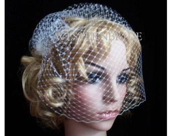 On side  Bridal White or Ivory Russian face veil with Swarovski crystals. Brand new with comb ready to wear