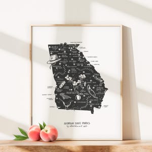 May include: A black and white illustration of the state of Georgia with the locations of all the state parks marked. The parks are listed by their establishment date. The title of the illustration is "Georgia State Parks by establishment date".
