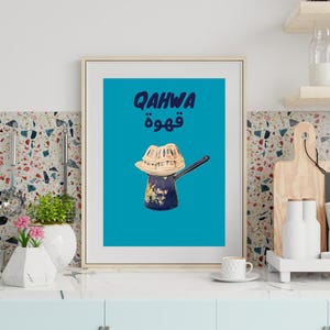 May include: A blue and white Turkish coffee pot with a traditional design. The pot is topped with a woven metal strainer and the text "QAHWA قهوة" is printed in blue on a turquoise background.