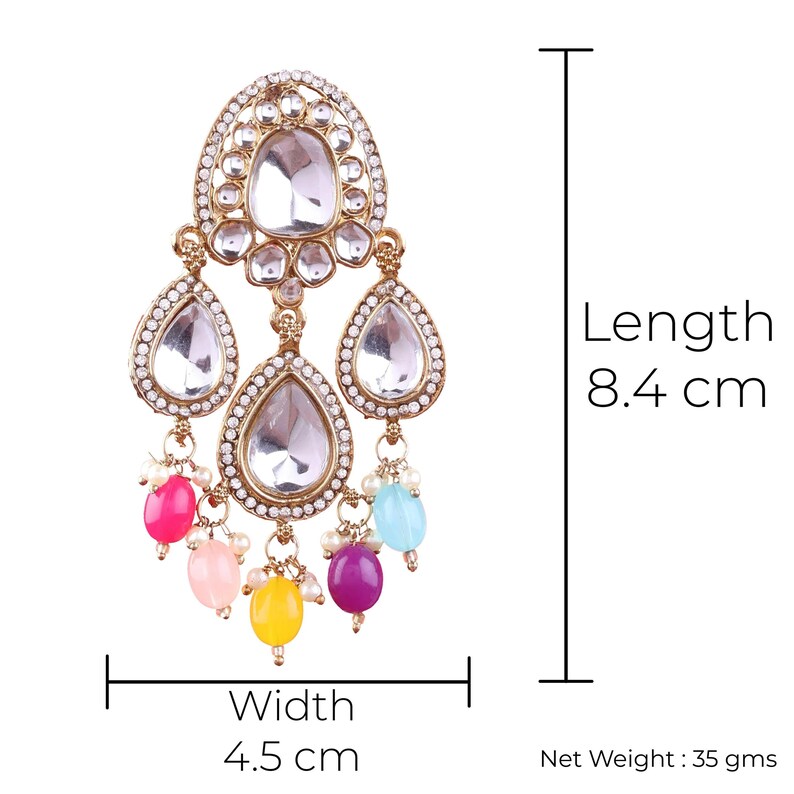 May include: A gold-tone earring with a teardrop-shaped design. The earring features clear rhinestones and colorful beads in pink, yellow, blue, and purple. The earring measures 8.4 inches in length and 4.5 inches in width. Net Weight: 35 grams.