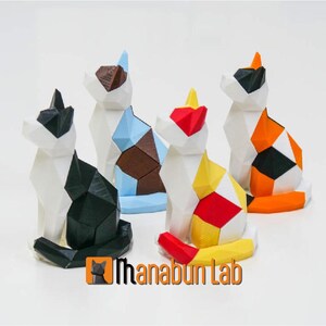 May include: Five colorful geometric cat figurines made of 3D printed plastic. The cats are in various poses and have different color combinations, including black and white, brown and blue, red and yellow, and orange and black.