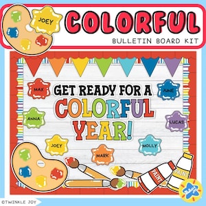 Pode incluir: Um kit de quadro de avisos colorido com o texto "COLORFUL" e "GET READY FOR A COLORFUL YEAR!". Inclui paletas de tinta, tubos de tinta, pincéis e etiquetas com nomes. O kit é projetado com um esquema de cores do arco-íris.