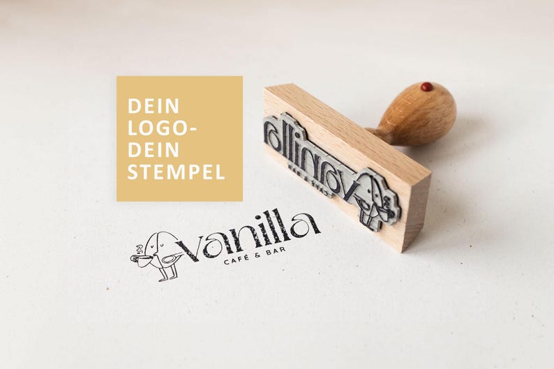 May include: A wooden stamp with the text "rollin'" and a small illustration of a bird with a coffee cup. The stamp is on a white surface with the text "DEIN LOGO-DEIN STEMPEL" in a yellow box and the text "Vanilla Cafe & Bar" with a small illustration of a bird with a coffee cup.